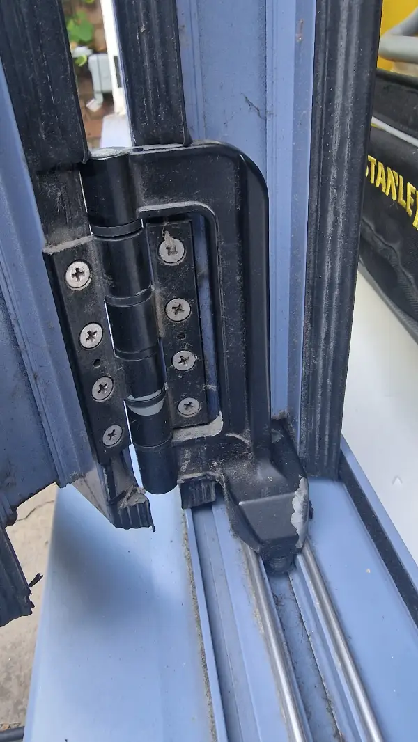 Bi-fold door hinge and roller adjustment carried out in Dulwich, South East London, to correct door alignment and operation.
