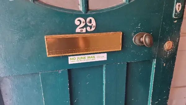 New brass letterbox professionally fitted to a timber front door in Norbury, South London.