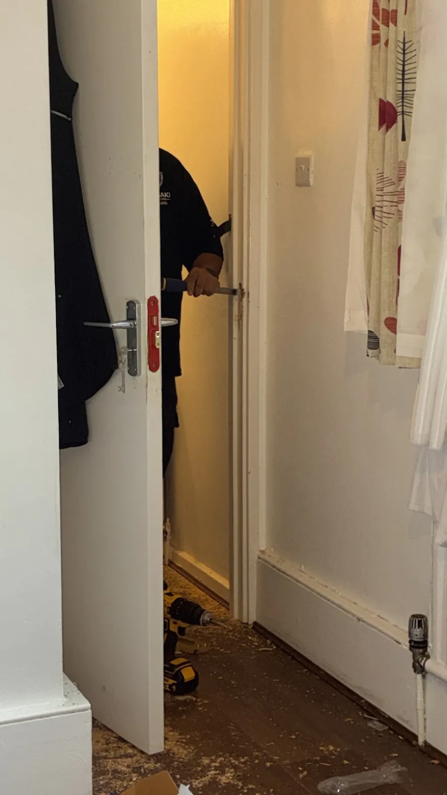 Bluesaki engineer fitting a mortice lock into a timber door edge